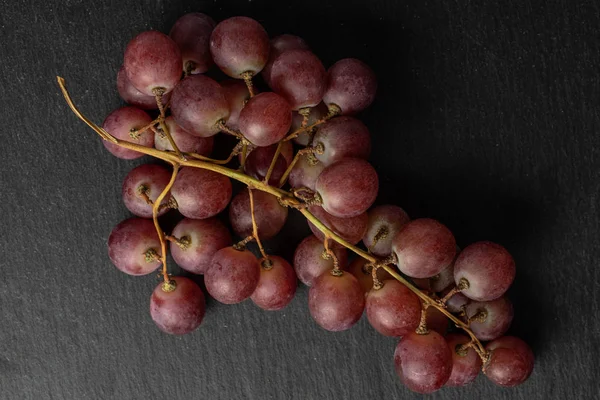 Rose wine grape on grey stone — Stock Photo, Image