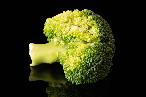 Fresh breen broccoli isolated on black glass — Stock Photo, Image