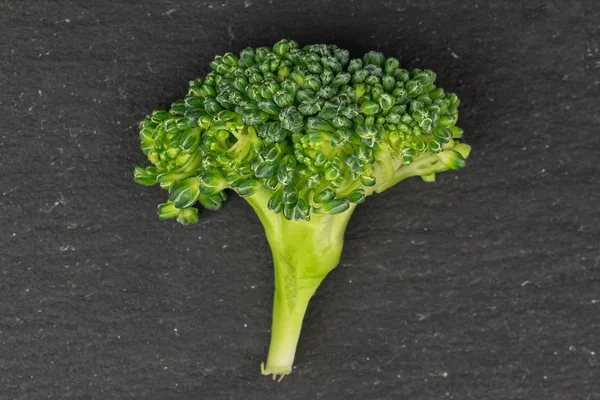 Fresh breen broccoli on grey stone — Stock Photo, Image