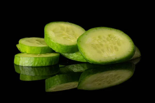 Fresh mini cucumber isolated on black glass — Stock Photo, Image