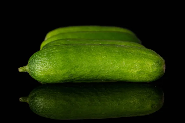 Fresh mini cucumber isolated on black glass — Stock Photo, Image