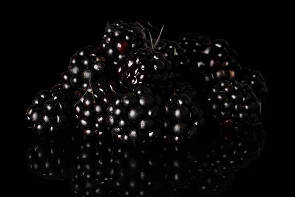 Fresh blackberry isolated on black glass — Stock Photo, Image