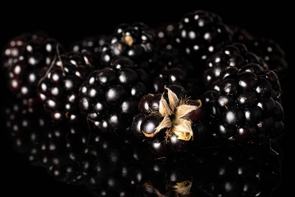 Fresh blackberry isolated on black glass — Stock Photo, Image