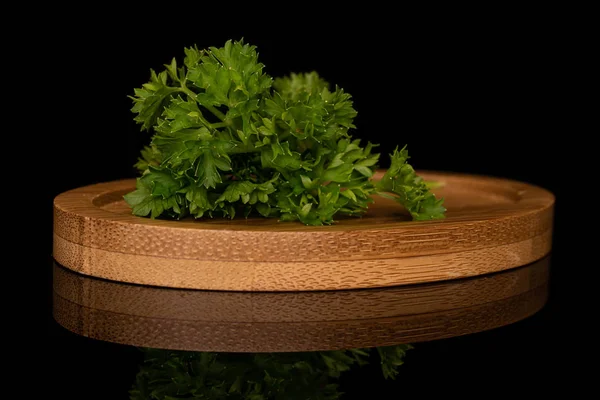 Fresh green parsley isolated on black glass — Stock Photo, Image