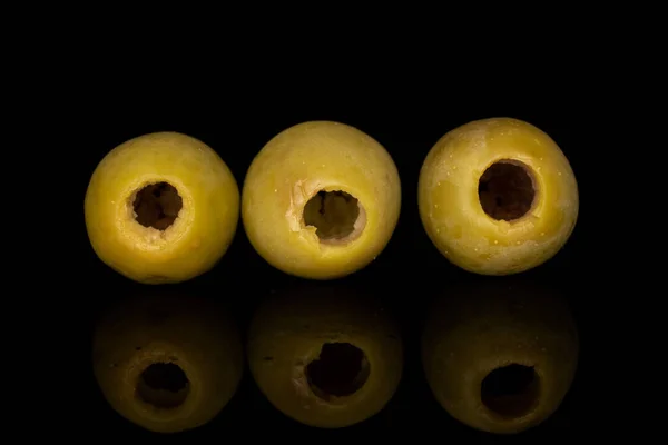 Green marinated olive isolated on black glass — ストック写真