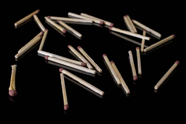 Brown safety match isolated on black glass — Stock Photo, Image