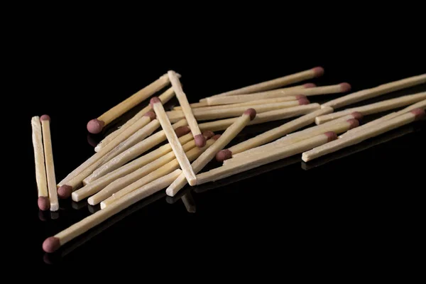 Brown safety match isolated on black glass — Stock Photo, Image