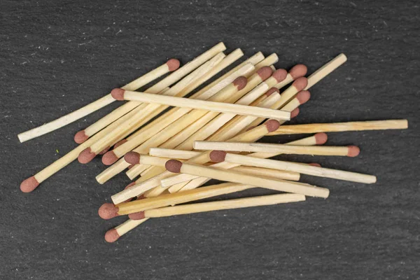 Brown safety match on grey stone — Stock Photo, Image