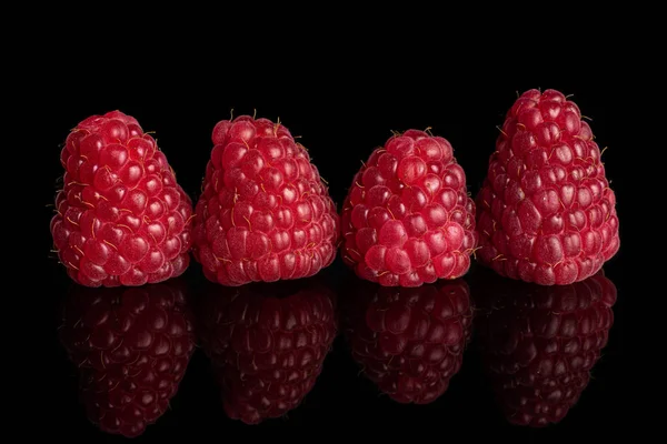 Fresh red raspberry isolated on black glass — Stock Photo, Image