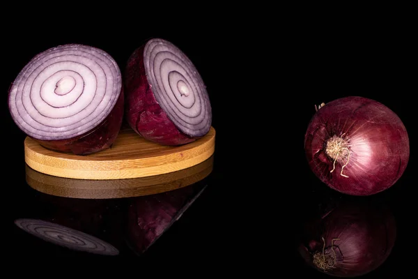 Fresh red onion isolated on black glass — Stock Photo, Image