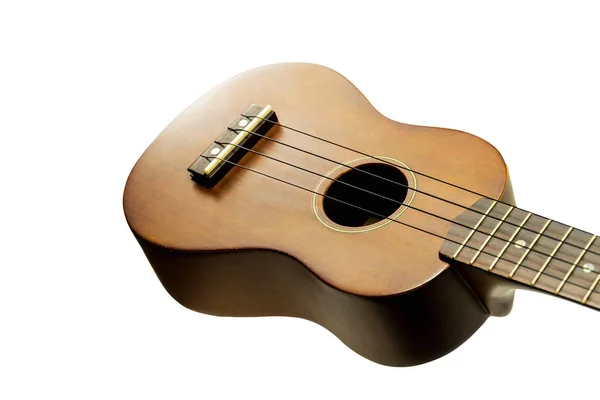 O ukulele marrom no fundo branco — Fotografia de Stock