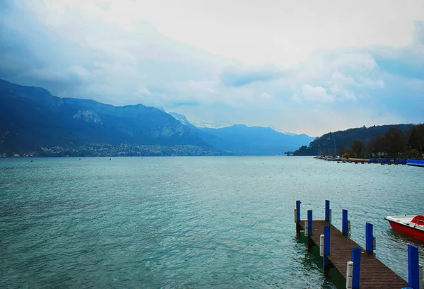 Beautiful Annecy landscape. Rainy day Blue lake and mountains