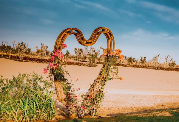 Heart-shaped huge love board at the Love Lakes Dubai. A new tourist destination in the vicinity of Al Qudra Lakes Dubai. Love Lake is one of the major tourist attraction in Dubai.