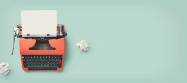 retro banner with red vintage typewriter with a blank sheet of paper and paper balls, top view, copyspace clipart