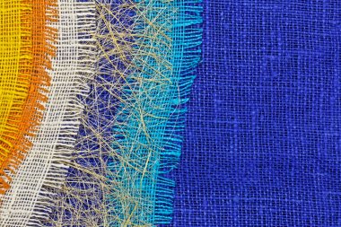 Soyut çok renkli güzel arka plan, pamuk kaba kumaş parçalarından yapılmış.