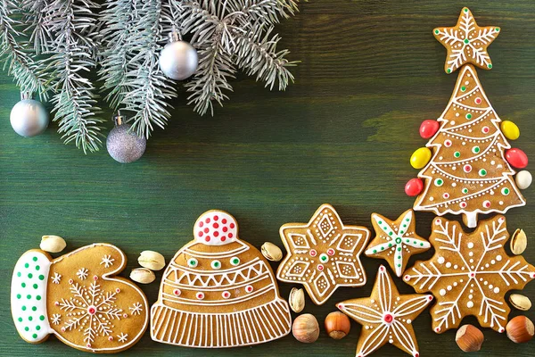 Christmas Gingerbread Different Sweets Nuts Ornaments Lie Wooden Table Green — Stock Photo, Image