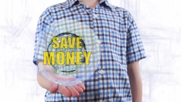 Giovane uomo mostra un ologramma del pianeta Terra e testo Risparmiare denaro — Video Stock