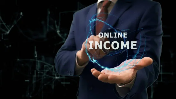 Businessman shows concept hologram Online income on his hand — Stock Photo, Image
