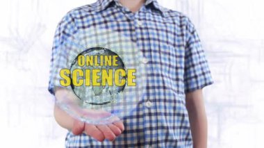 Genç adam bir hologram Dünya gezegeninin ve metin çevrimiçi bilim gösterir
