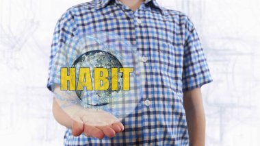 Genç adam bir hologram Dünya gezegeninin ve metin alışkanlık gösterir