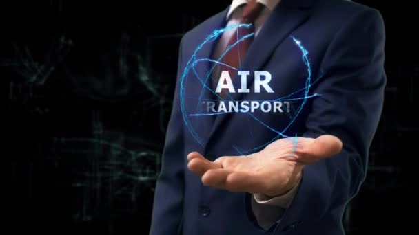 Omul de afaceri prezintă holograma conceptului Transportul aerian pe mâna sa — Videoclip de stoc
