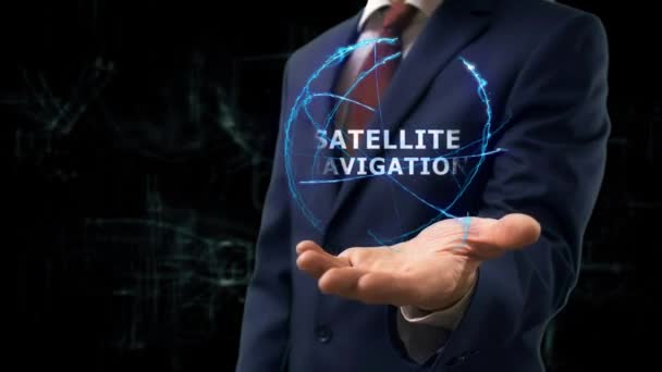 Businessman shows concept hologram Satellite navigation on his hand — Stock Video