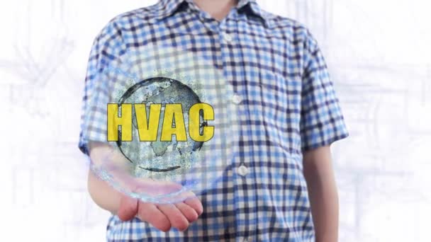 Молодий чоловік показує голограму планети Земля і текст HVAC — стокове відео