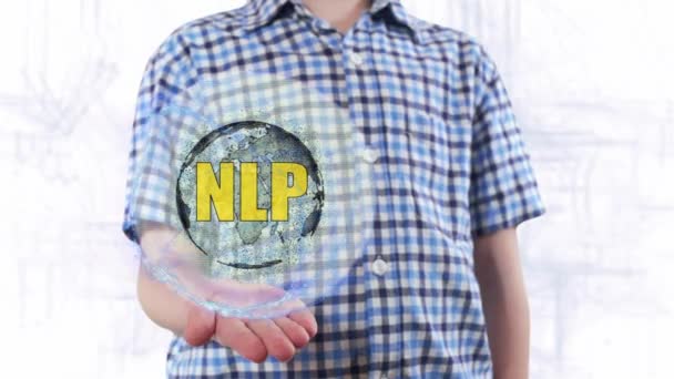 Joven muestra un holograma del planeta Tierra y texto NLP — Vídeos de Stock