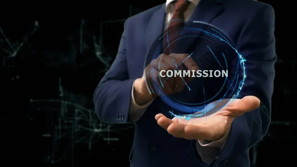 Businessman shows concept hologram Commission on his hand — Stock Photo, Image