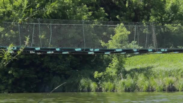 Blue cable bridge over the river — Stock Video