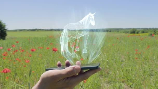 Голограмма лошади на смартфоне — стоковое видео