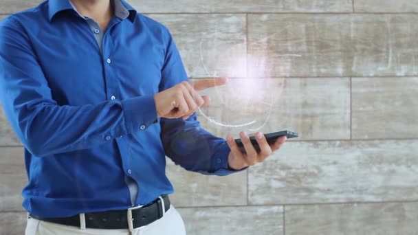 Man activates a conceptual hologram with ultra laptop in the center — Stock Video
