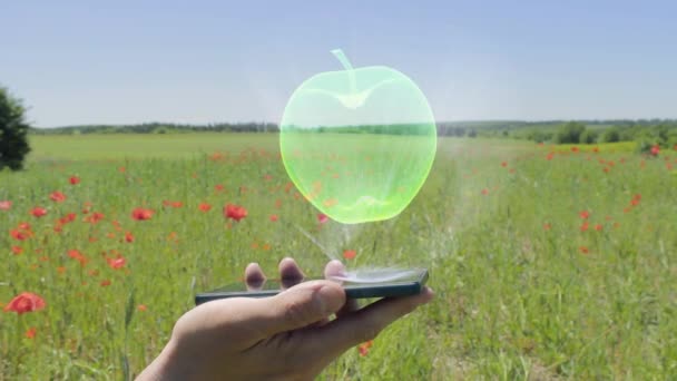 Hologramm von Apfel auf dem Smartphone — Stockvideo
