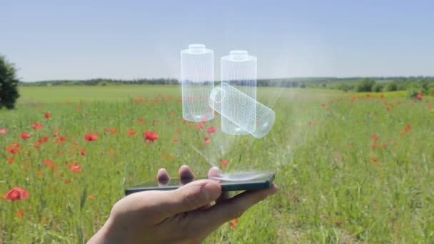 Hologramme des batteries rechargeables sur un smartphone — Video