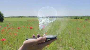 Hologram insan kafatası bir smartphone cep telefonu ile