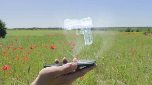 Holograma de arma en un smartphone — Vídeos de Stock
