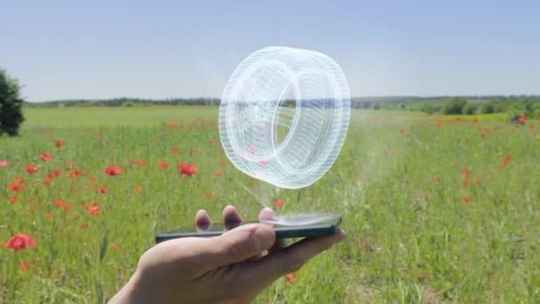 Hologram of car wheel on a smartphone — Stock Video