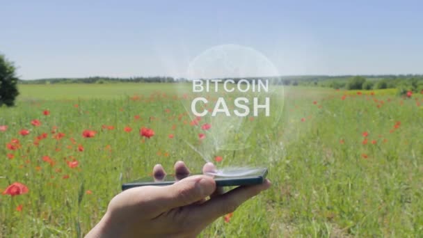 Hologram Bitcoin készpénz a smartphone — Stock videók