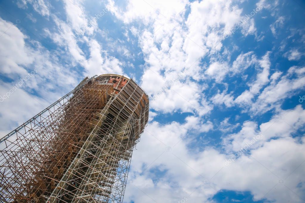 A low angle view of the Vukovar water tower under construction and intended to be a memorial place in Vukovar, Croatia. It is a symbol of the city suffering in the Croatian War of Independence.