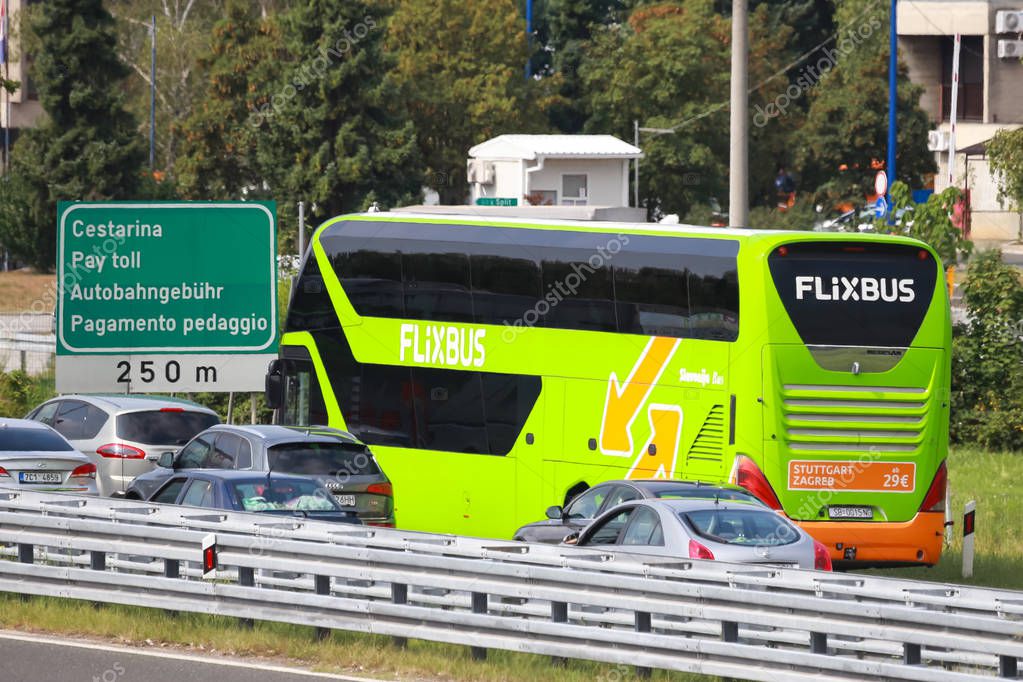 Zagreb, Croatia - August 11th,2018 :Green bus of Flixbus company stuck in traffic jam due to the large number of tourists going to the sea coast of Croatia in the Lucko highway toll in Zagreb,Croatia.