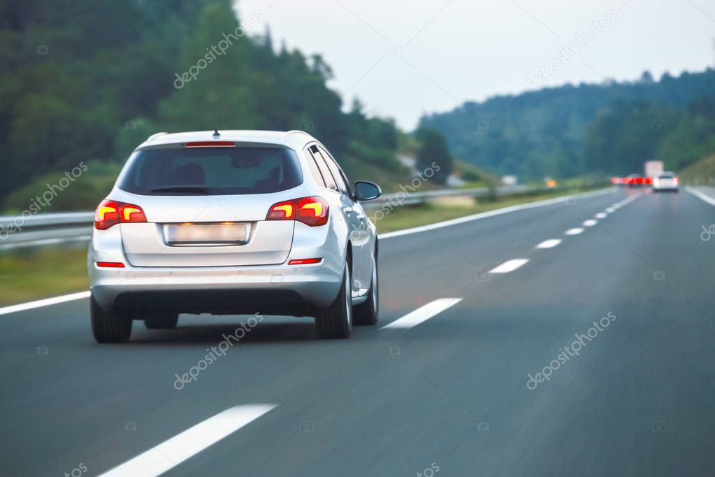 Car driving on the highway from Rijeka to Zagreb with Gorski Kotar forest in the background in Croatia.