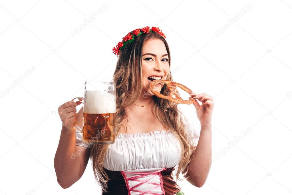 Attractive girl in traditional german costume with pretzel and beer on Oktoberfest, isolated on white