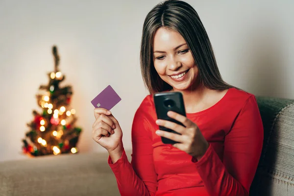 Women Holding Smart Phone Credit Card Christmas Shopping Online Home — Stock Photo, Image