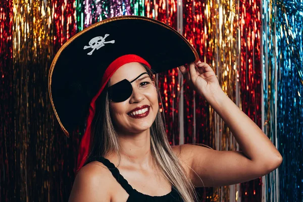 Beautiful young black woman having fun with a fake party pirate costume