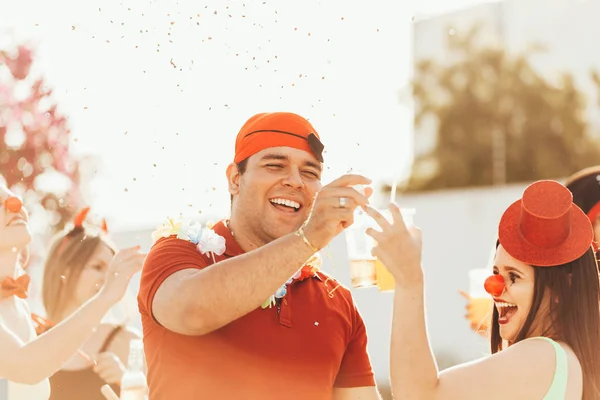 Brazilian Carnival. Couple in costume enjoying the carnival party in the city