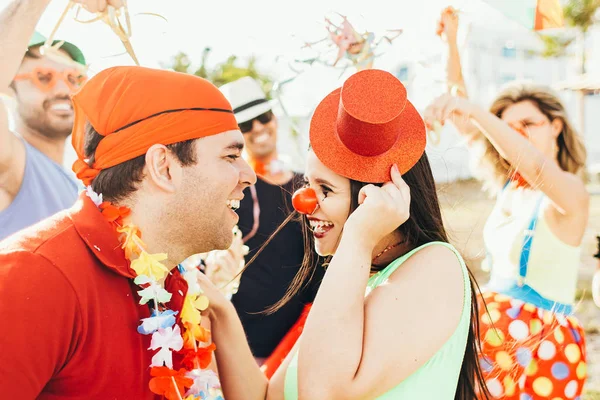 Brazilian Carnival. Couple in costume enjoying the carnival party in the city