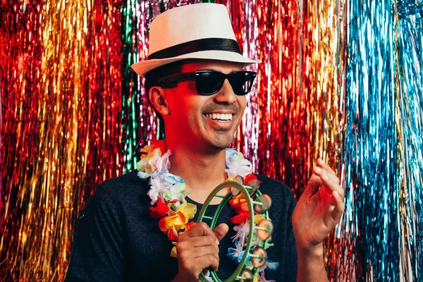 Brazilian Carnival. Young man in costume enjoying the carnival party