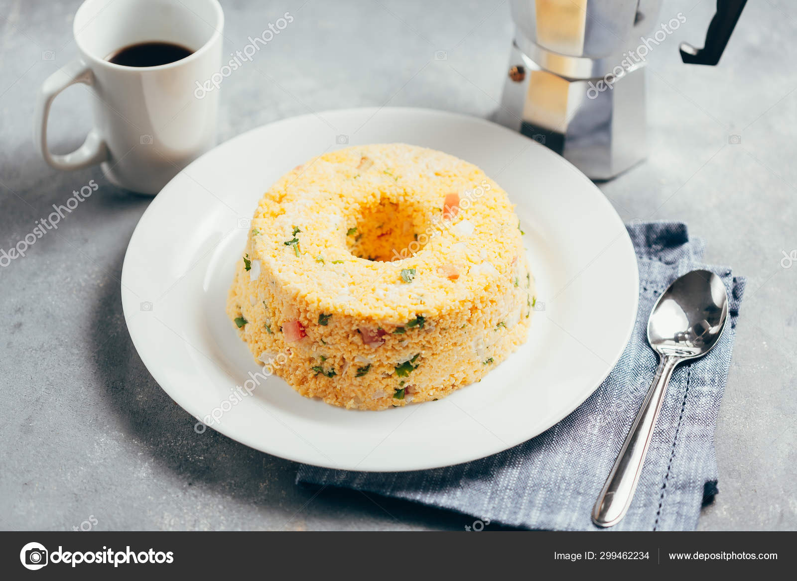Cuscuz. Traditional Brazilian food prepared from corn flour Stock Photo