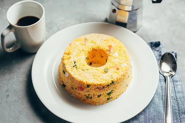 Cuscuz. Traditional Brazilian food prepared from corn flour Stock Photo