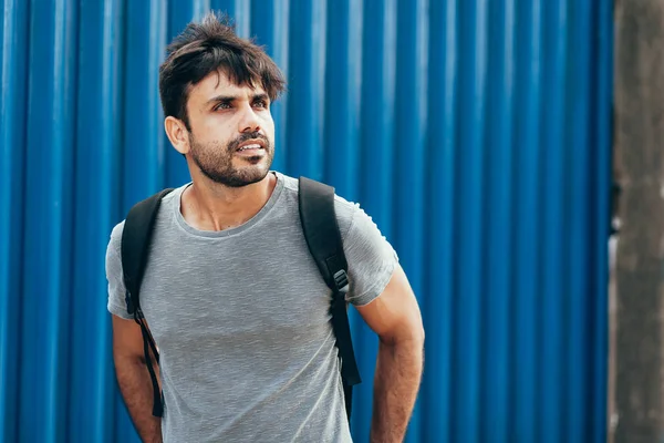 Outdoor portrait of handsome young male student with backpack — Stock Photo, Image